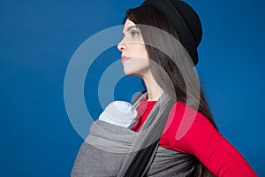 Active motherhood babywearing in woven wrap baby carrier