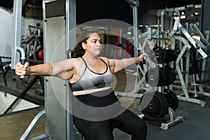 Active obese woman at the gym