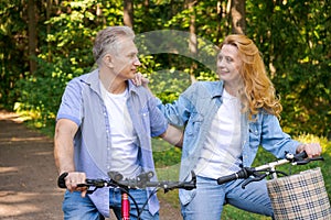 Active old age, people and lifestyle concept happy senior couple riding