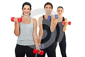 Active people working with barbell