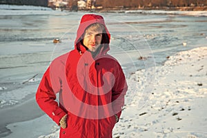 Active rest. travel and expedition concept. man in parka. winter male fashion. warm clothes for cold climate. weather