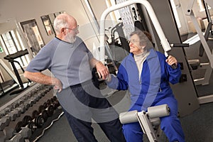 Active Senior Adult Couple Working Out Together in the Gym