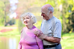 Active senior couple relaxing in the park