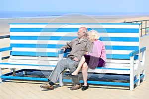 Active senior couple relaxing at the sea