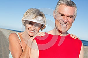 Active senior couple stretching before a jog