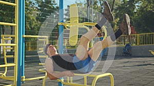 Active senior elderly old caucasian man do physical exercises in sport playground. Fitness leisure. Healthy lifestyle in