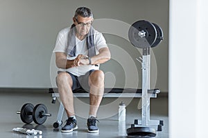 Active senior exercising in a gym