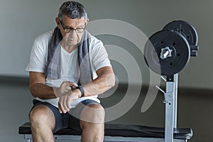 Active senior exercising in a gym