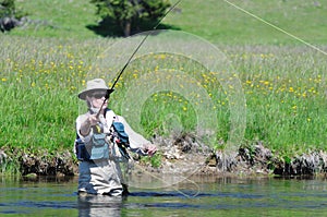 Active senior female fishing portrait