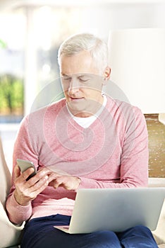 Active senior man banking online