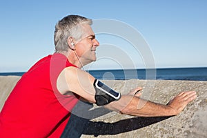 Active senior man stretching before a jog