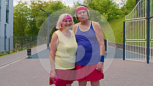 Active senior man, woman after fitness cardio exercises, smiling looking at camera, sport motivation