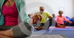 Active senior people performing yoga in fitness studio 4k