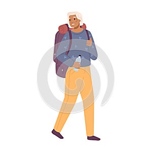 Active senior woman with backpack hiking