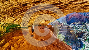 Active Senior woman in a cave on a hike on the Canyon Overlook Trail in Zion National Park, Utah