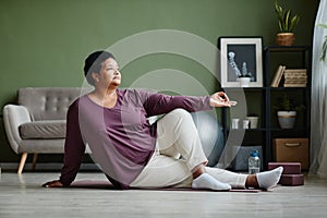 Active Senior Woman doing Yoga at Home