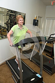 Active Senior Woman Exercise Treadmill Machine