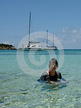 Active Senior Woman Swimming in Tropical Bay