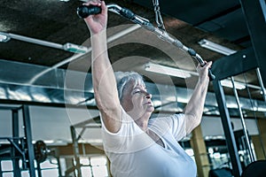Active senior woman working exercise in the gym.