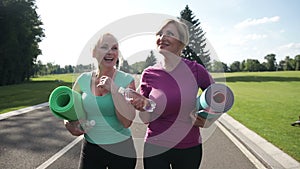 Active senior women going to train outdoors