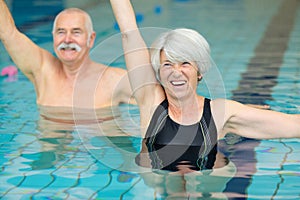 active seniors doing water exercises