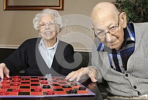 Active Seniors Playing Checkers photo