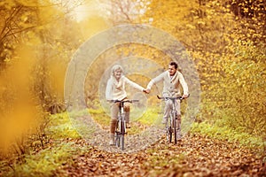 Active seniors riding bike