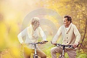 Active seniors riding bike