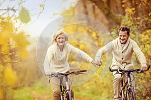 Active seniors riding bike