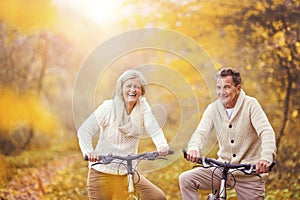 Active seniors riding bike