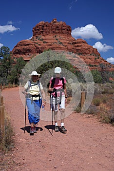 Active Seniors Walking on Mountain Trail