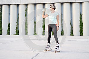 active seniors woman roller blading in city outdoor photo