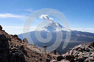 Active snowcapped Popocatepetl volcano with visible smoke, Mexico