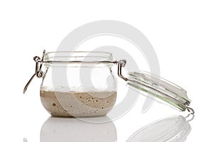 Active sourdough starter in a glass jar for homemade bread