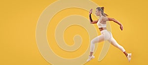 active sport girl runner running on yellow background. Woman jumping running banner with mock up copyspace.