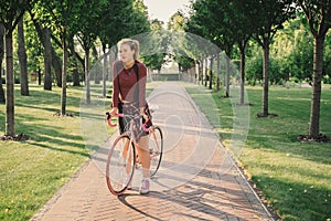 Active sport woman with bicycle