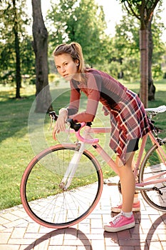Active sport woman with bicycle
