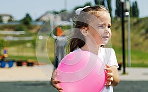 Active sports for preschoolers. Ball game for children. playing outside with a ball and walking on the playground in the park