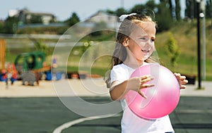Active sports for preschoolers. Ball game for children. playing outside with a ball and walking on the playground in the park