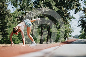 Active Sports Woman Performing Cartwheel in the Park on a Sunny Day