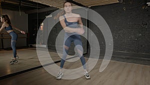 Active sporty fit pretty woman doing skater lunges exercise in fitness club