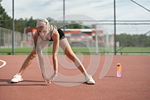 Active Stretching: Fitness Enthusiast at Outdoor Court