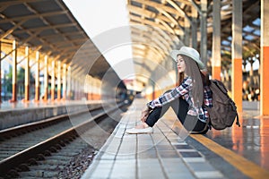 Active and travel lifestyle concept, Woman traveler tourist walking with luggage at train station