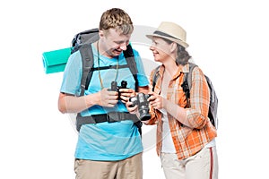 Active travelers with backpacks, girl with camera