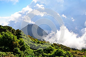 Active volcano Yzalco in clouds photo