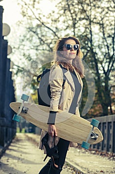 Active woman with longboard