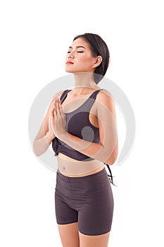 Active woman practicing yoga sun salutation