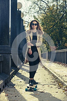 Active woman riding longboard