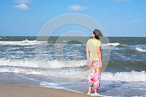 Active woman, surfer is waiting waves