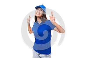 active young brunette woman promoter in blue t-shirt and cap on white background with copy space